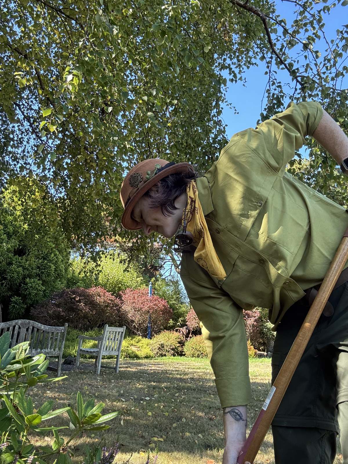 Taya tending a garden bed in a client's Humboldt garden